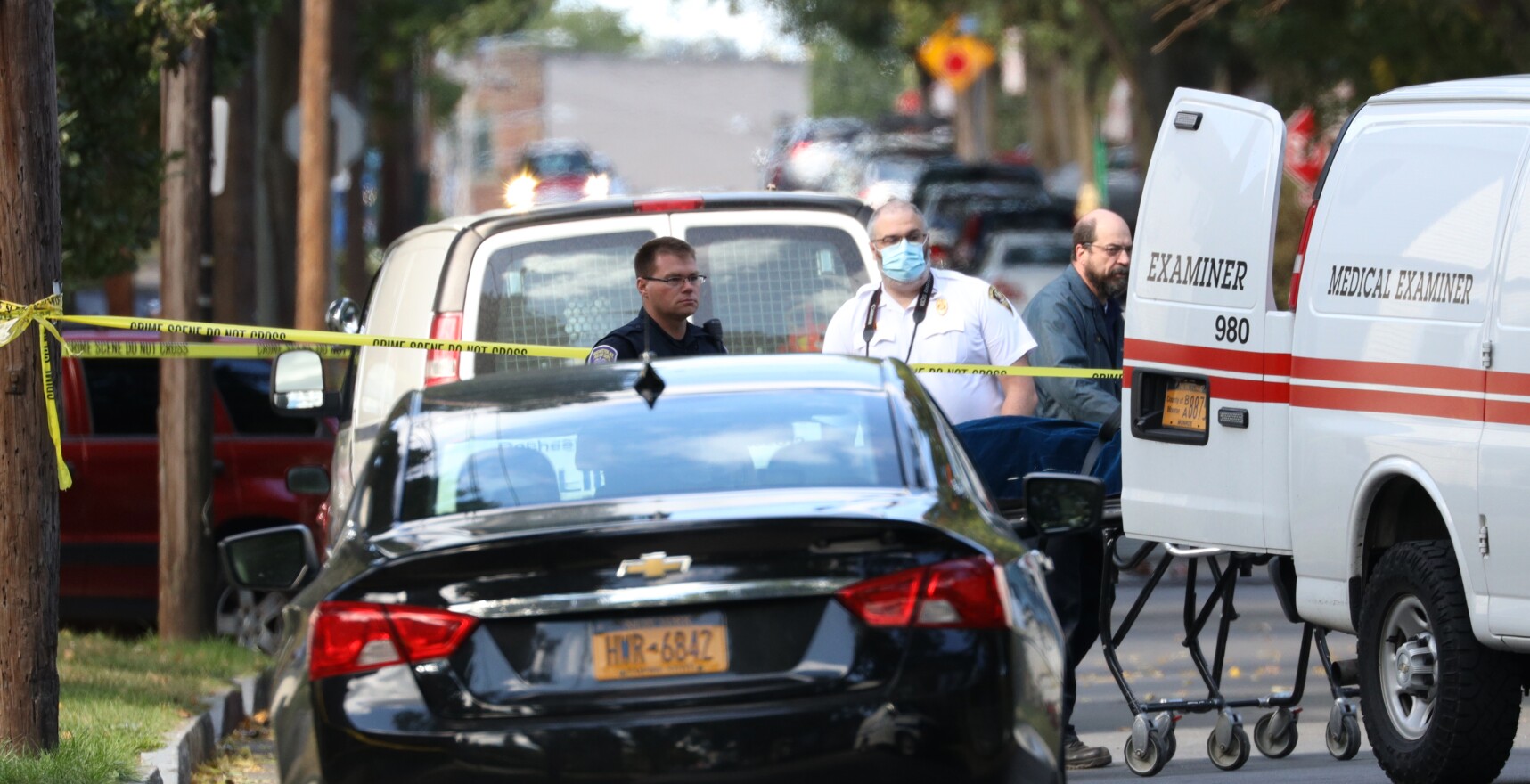 The Monroe County Medical Examiner took custody of two bodies from the backyard of 278 Pennsylvania Ave. after a mass shooting took place.
